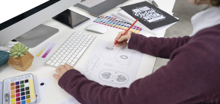 graphic-designer-making-logo-notebook