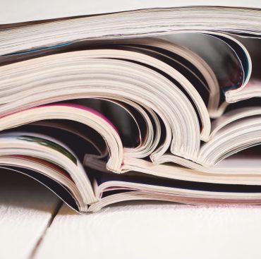 pile-colorful-magazines-table